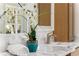 Bathroom with marble countertop, potted flowers, and storage cabinet at 431 Clifton Ne Rd, Atlanta, GA 30307