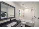 Clean bathroom with a dark granite vanity, white subway tile, shower and washer and dryer hookups at 431 Clifton Ne Rd, Atlanta, GA 30307