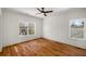 Bright bedroom features hardwood floors, fresh paint, large windows, and a ceiling fan at 431 Clifton Ne Rd, Atlanta, GA 30307