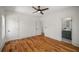 Charming bedroom with hardwood floors, white trim and a view of the connected bathroom at 431 Clifton Ne Rd, Atlanta, GA 30307