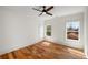 Spacious bedroom featuring hardwood floors, neutral paint, and natural light from two windows at 431 Clifton Ne Rd, Atlanta, GA 30307