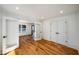 Bright bonus room with double doors, hardwood floors, white trim, and recessed lighting at 431 Clifton Ne Rd, Atlanta, GA 30307