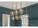 Close-up of modern chandelier with crystal pendants, adding a touch of sophistication to the dining room's design at 431 Clifton Ne Rd, Atlanta, GA 30307