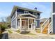 Charming two-story home with inviting front porch, professional landscaping, and private driveway at 431 Clifton Ne Rd, Atlanta, GA 30307