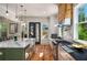 Bright kitchen with a large island, hardwood floors, stainless appliances, and stone countertops at 431 Clifton Ne Rd, Atlanta, GA 30307