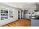 Modern kitchen with gray cabinets, stainless steel appliances, hardwood floors and large windows at 431 Clifton Ne Rd, Atlanta, GA 30307