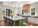 Modern kitchen with island seating, stainless steel appliances, and white cabinetry, great for cooking and entertaining at 431 Clifton Ne Rd, Atlanta, GA 30307