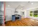 Charming kitchenette with blue cabinets, stainless steel appliances, hardwood floors and a large window at 431 Clifton Ne Rd, Atlanta, GA 30307