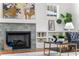 Living room with a cozy fireplace, stylish decor, and built-in shelving, creating an inviting atmosphere at 431 Clifton Ne Rd, Atlanta, GA 30307