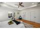 Main bedroom with hardwood floors, stylish furnishings, and a large window overlooking the backyard at 431 Clifton Ne Rd, Atlanta, GA 30307