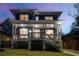 Inviting two-story home featuring a covered front porch and warm exterior lighting at 431 Clifton Ne Rd, Atlanta, GA 30307