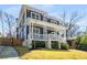 Elegant two-story home with a covered front porch and a well-manicured lawn at 431 Clifton Ne Rd, Atlanta, GA 30307