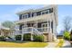 Beautiful two-story home featuring a covered front porch and a driveway at 431 Clifton Ne Rd, Atlanta, GA 30307