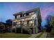Attractive two-story home with a covered front porch and exterior lights at 431 Clifton Ne Rd, Atlanta, GA 30307