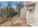 Multi-level deck and backyard showcasing the outdoor living and natural surroundings at 8498 Colony Club Dr, Alpharetta, GA 30022