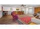 Finished basement with vinyl flooring, neutral colors, a bar, and accent rug at 8498 Colony Club Dr, Alpharetta, GA 30022