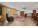 Finished basement with vinyl flooring, neutral colors, and bar area at 8498 Colony Club Dr, Alpharetta, GA 30022