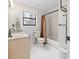 A bathroom features white tile flooring, granite countertop and neutral paint at 8498 Colony Club Dr, Alpharetta, GA 30022