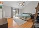Spacious bedroom with vaulted ceiling, a ceiling fan, and access to private deck at 8498 Colony Club Dr, Alpharetta, GA 30022