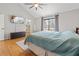 Primary bedroom featuring vaulted ceiling, ceiling fan, and private balcony at 8498 Colony Club Dr, Alpharetta, GA 30022