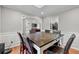 Traditional dining room featuring a dark wood table, leather chairs, and trim at 8498 Colony Club Dr, Alpharetta, GA 30022