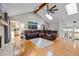 Inviting living room with hardwood floors, skylights, and access to other rooms at 8498 Colony Club Dr, Alpharetta, GA 30022