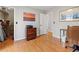 Bright office space with hardwood floors, natural light, and sunset painting at 8498 Colony Club Dr, Alpharetta, GA 30022