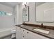 Bathroom featuring double sinks with a dark countertop and bright modern lighting at 2175 James Aly, Atlanta, GA 30345