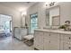 Bright bathroom features double vanity sinks, neutral cabinets, marble countertops and floors at 2175 James Aly, Atlanta, GA 30345