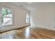Sunlit bedroom with hardwood floors, crown molding, and three large windows at 2175 James Aly, Atlanta, GA 30345
