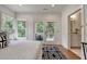 Bright bedroom has a private balcony, hardwood floors, a stylish rug, and an ensuite bathroom at 2175 James Aly, Atlanta, GA 30345