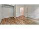 Empty bedroom features hardwood floors, white trim, and a closet with double doors at 2175 James Aly, Atlanta, GA 30345