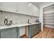 The butler's pantry includes stone backsplash, custom cabinets, and countertop space, great for entertaining at 2175 James Aly, Atlanta, GA 30345