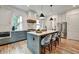 Stylish kitchen with island seating, stainless appliances, and custom range hood at 2175 James Aly, Atlanta, GA 30345
