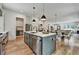 Modern kitchen featuring a central island with sink and stainless steel appliances at 2175 James Aly, Atlanta, GA 30345