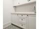 Laundry room with white shaker cabinets and patterned floors at 2175 James Aly, Atlanta, GA 30345