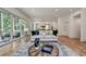 Bright living room with large windows, hardwood floors, and stylish furniture at 2175 James Aly, Atlanta, GA 30345