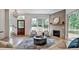 Inviting living room with a cozy fireplace and abundant natural light at 2175 James Aly, Atlanta, GA 30345
