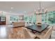 Open concept living room with fireplace and large windows providing ample natural light at 2175 James Aly, Atlanta, GA 30345