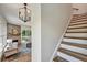 Open-concept living area with staircase and fireplace at 2175 James Aly, Atlanta, GA 30345