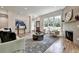 Stylish living room with a fireplace, large windows, and comfortable seating at 2175 James Aly, Atlanta, GA 30345
