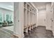 Bright mudroom features slate tile floors and a large built-in storage system with shelves and seating at 2175 James Aly, Atlanta, GA 30345