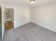 Comfortable bedroom with plush carpeting, neutral walls, and an open door, creating an inviting space at 2917 Yukon Nw Trl, Acworth, GA 30101
