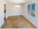 Inviting dining room with a chandelier and a large window offering natural light and backyard views at 2917 Yukon Nw Trl, Acworth, GA 30101