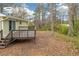 A charming deck overlooks a lush backyard, ideal for outdoor gatherings and relaxation at 4690 Big Valley Ct, Stone Mountain, GA 30083