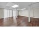 Spacious basement with modern flooring, white pillars, and plenty of natural light at 4690 Big Valley Ct, Stone Mountain, GA 30083