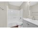 Clean bathroom featuring a shower/tub combo, gray vanity, and modern fixtures at 4690 Big Valley Ct, Stone Mountain, GA 30083