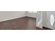 Bright entryway featuring wood floors and a freshly painted white front door at 4690 Big Valley Ct, Stone Mountain, GA 30083