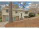 Split-level home with unique architectural details and a stone facade on the lower level at 4690 Big Valley Ct, Stone Mountain, GA 30083