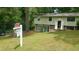 Split level home with lawn and stone accents at 4690 Big Valley Ct, Stone Mountain, GA 30083